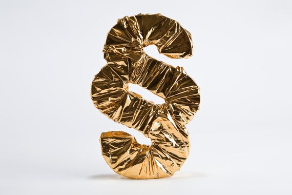 Paragraphen-Symbol aus goldener Folie